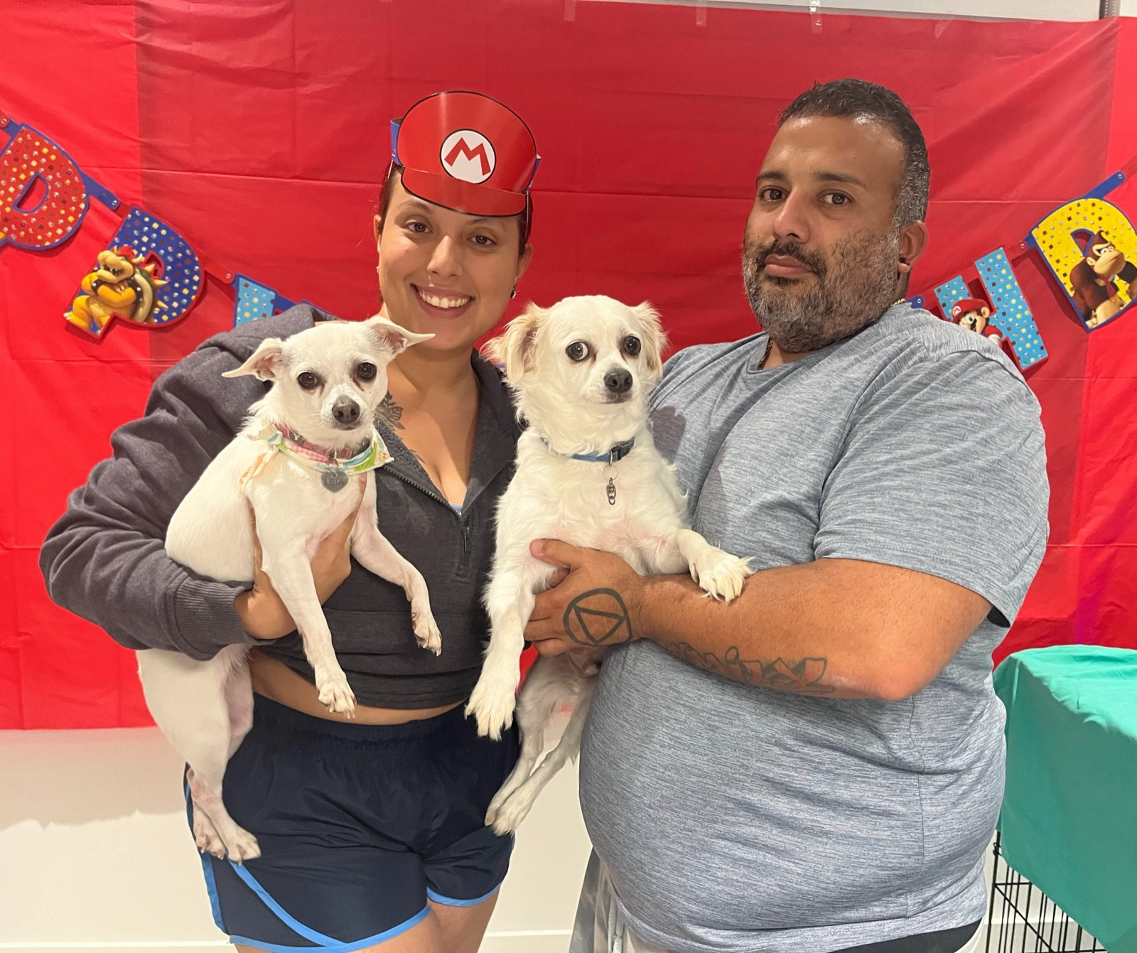 Kimberly Vazquez, owner of Paws Country Club Inc, with happy clients